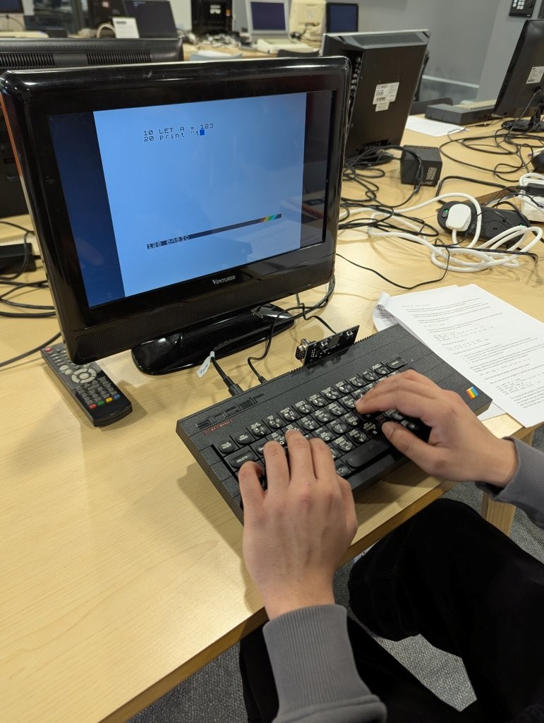 Someone coding on a Spectrum Plus